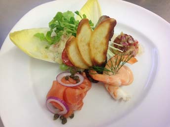 Mixed Seafood Plate served with selection of smoked, cooked and grilled Seafood “Salmon, King Prawns and Scallops” served on warm Creamed Potato Salad